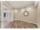 Bonus room with wood-look flooring and an open door to the hallway and living spaces at 10520 Boardwalk Loop # 503, Bradenton, FL 34202