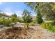 Backyard featuring a beautiful garden, mature trees, and a tranquil ambiance at 11551 30Th E Cv, Parrish, FL 34219