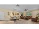 Inviting living room featuring hardwood floors, neutral walls, and comfortable seating at 11551 30Th E Cv, Parrish, FL 34219