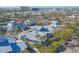 Stunning aerial view of a neighborhood showcasing coastal architecture and lush landscaping near the beach at 1239 Siesta Bayside Dr # 1239C, Sarasota, FL 34242