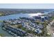 Expansive aerial view of a waterfront community, featuring a mix of homes, waterways, and the open bay at 1239 Siesta Bayside Dr # 1239C, Sarasota, FL 34242