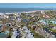 An aerial view of the community shows the beach, the intercoastal, tennis courts, and pristine landscaping at 1239 Siesta Bayside Dr # 1239C, Sarasota, FL 34242