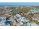 An aerial view captures the close proximity to the beach, the intercoastal, and the verdant community at 1239 Siesta Bayside Dr # 1239C, Sarasota, FL 34242