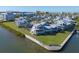 Scenic aerial view of waterfront homes, showcasing coastal charm with private docks and lush landscaping near the waterfront at 1239 Siesta Bayside Dr # 1239C, Sarasota, FL 34242