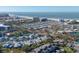 Breathtaking aerial view of the coastal community near the ocean, offering stunning views of the town and the water at 1239 Siesta Bayside Dr # 1239C, Sarasota, FL 34242