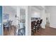 Bright kitchen with white cabinetry, stainless steel appliances and breakfast bar with seating overlooking living area at 1239 Siesta Bayside Dr # 1239C, Sarasota, FL 34242