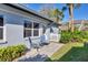 Charming patio area with comfortable seating and views of lush landscaping at 1239 Siesta Bayside Dr # 1239C, Sarasota, FL 34242