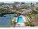 Inviting community swimming pool and tennis court, surrounded by lush landscaping, perfect for recreation and relaxation at 1239 Siesta Bayside Dr # 1239C, Sarasota, FL 34242