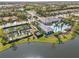 Aerial view of a community featuring a pool, tennis courts, and lush landscaping at 12959 Seasong Ter, Bradenton, FL 34211