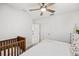 Bright bedroom features a ceiling fan, and a charming crib at 12959 Seasong Ter, Bradenton, FL 34211