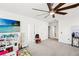 Bright bonus room with white walls, ceiling fan, and play area for children at 12959 Seasong Ter, Bradenton, FL 34211