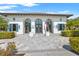Exterior of a clubhouse with an American flag and manicured landscaping at 12959 Seasong Ter, Bradenton, FL 34211
