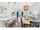 Open-concept kitchen and dining area with barstool seating and hardwood floors at 12959 Seasong Ter, Bradenton, FL 34211