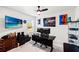Bright office with an adjustable desk, and decor at 12959 Seasong Ter, Bradenton, FL 34211