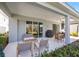 Covered patio with comfortable seating and outdoor grill at 12959 Seasong Ter, Bradenton, FL 34211