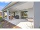 Spacious covered patio with a ceiling fan, BBQ grill and outdoor seating at 12959 Seasong Ter, Bradenton, FL 34211