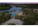 Waterfront home features a private dock, tiki hut, pool and lovely landscaping at 1410 San Jose Dr, Englewood, FL 34223