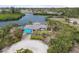 Waterfront home features a private dock, tiki hut, pool and lovely landscaping at 1410 San Jose Dr, Englewood, FL 34223