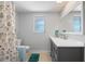 Bathroom featuring a single vanity, a standard shower/tub combo, and neutral walls at 1410 San Jose Dr, Englewood, FL 34223