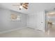 Cozy bedroom featuring a standard window, ample closet space, neutral paint, and easy access to common areas at 1410 San Jose Dr, Englewood, FL 34223