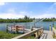 Private boat dock with boat lifts on the water offering convenient access for boating and water activities at 1410 San Jose Dr, Englewood, FL 34223