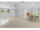 Open concept dining area with neutral walls and flooring at 1410 San Jose Dr, Englewood, FL 34223