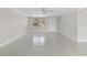 Bright living room featuring neutral walls, a ceiling fan, and lots of natural light at 1410 San Jose Dr, Englewood, FL 34223