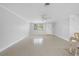 Bright living room featuring neutral walls, a ceiling fan, and lots of natural light at 1410 San Jose Dr, Englewood, FL 34223