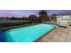 Stunning pool and patio overlooking the water, complete with a spa and a built in bar at 1410 San Jose Dr, Englewood, FL 34223