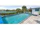 Stunning pool and patio overlooking the water, complete with a spa and a built in bar at 1410 San Jose Dr, Englewood, FL 34223