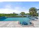 Stunning pool and patio overlooking the water, complete with a spa and a built in bar at 1410 San Jose Dr, Englewood, FL 34223