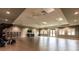 Large, open multipurpose room with wood flooring, mirrors, and fitness equipment at 14121 Heritage Landing Blvd # 734, Punta Gorda, FL 33955