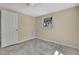 This bedroom features a window, tile floors, and a closet at 14914 Old Dixie Hwy, Hudson, FL 34667