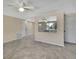 Spacious living room with tile floors, neutral paint, and plenty of natural light at 14914 Old Dixie Hwy, Hudson, FL 34667