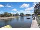 A serene waterfront view with docks, offering a peaceful escape and recreational opportunities at 14914 Old Dixie Hwy, Hudson, FL 34667