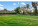 Dog park featuring green space with benches for relaxing and enjoying time outdoors with your furry friends at 15169 Vivaldi Dr, Nokomis, FL 34275