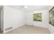 Bedroom with ceiling fan, neutral walls, and a large window at 1525 Fleetwood Dr, Sarasota, FL 34232