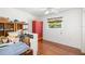 Bright bedroom featuring laminate floors and a window providing ample natural light at 1525 Fleetwood Dr, Sarasota, FL 34232