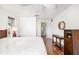 Bedroom with gleaming hardwood floors, neutral walls, and a ceiling fan at 1525 Fleetwood Dr, Sarasota, FL 34232