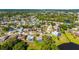 Aerial view of the residential community surrounded by lush green trees and waterways at 1525 Fleetwood Dr, Sarasota, FL 34232