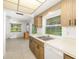 Functional kitchen with tile floors and view of the backyard and pool at 1525 Fleetwood Dr, Sarasota, FL 34232