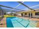 Enjoy the pool in a screened lanai, combining indoor comfort with outdoor living space at 1525 Fleetwood Dr, Sarasota, FL 34232