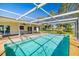 Bask in the sun by your screened pool; the perfect way to relax and enjoy the outdoors at 1525 Fleetwood Dr, Sarasota, FL 34232
