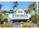 The community sign of Tamaron, a deed restricted community with tropical landscaping at 1525 Fleetwood Dr, Sarasota, FL 34232
