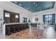 Modern clubhouse bar features a long countertop with seating and stylish decor at 15508 Leven Links Pl, Lakewood Ranch, FL 34202