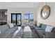 Inviting clubhouse lounge featuring comfortable seating, a decorative mirror, and scenic views at 15508 Leven Links Pl, Lakewood Ranch, FL 34202