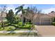 Charming single-story home with well-manicured landscaping and a three-car garage, perfect for curb appeal at 15508 Leven Links Pl, Lakewood Ranch, FL 34202