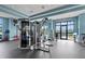 Well-equipped fitness center with state-of-the-art exercise machines, rubber flooring and bright lighting at 15508 Leven Links Pl, Lakewood Ranch, FL 34202