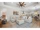 Open living room with sectional sofa, hardwood floors, recessed lights, and breakfast nook at 15508 Leven Links Pl, Lakewood Ranch, FL 34202
