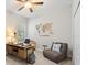 Home office with desk, chair, map wall decor and seating at 15508 Leven Links Pl, Lakewood Ranch, FL 34202
